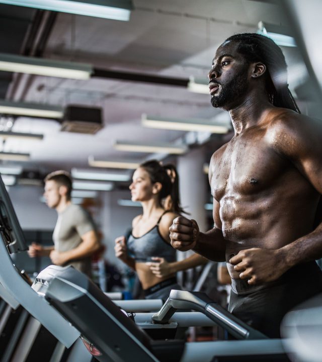 muscular-build-black-man-warming-up-on-treadmill-in-royalty-free-image-1097787044-1551194275